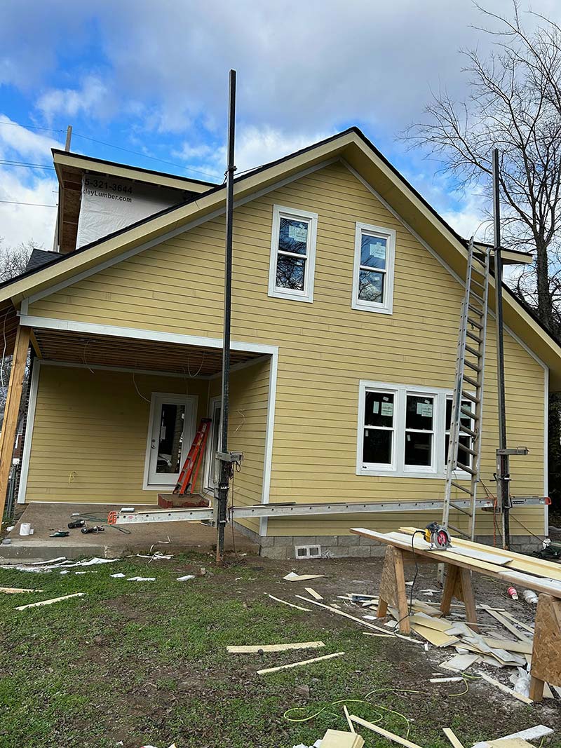 James Hardie siding installed on a two story home waiting for paint