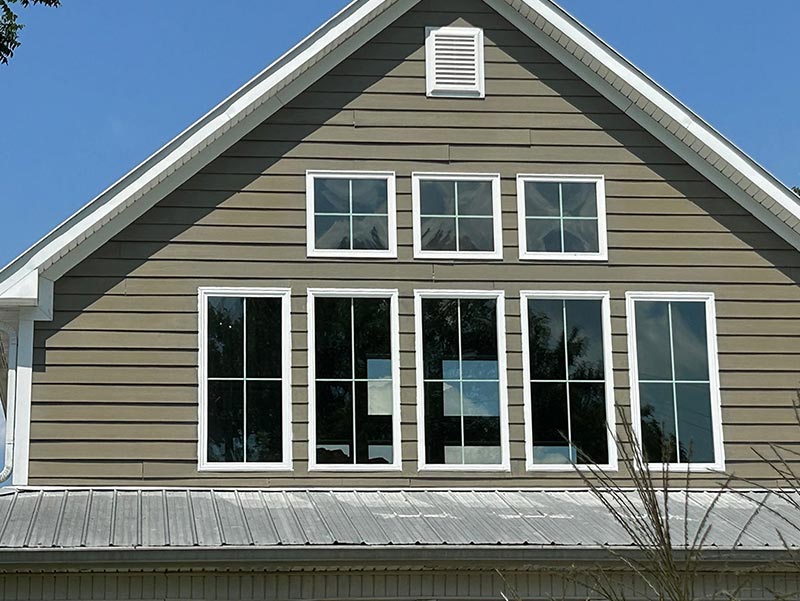 Siding and windows after a new siding repair
