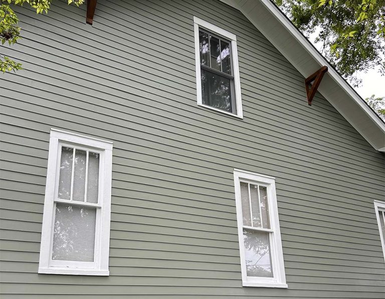 Side of nice home with new color mach james hardie siding