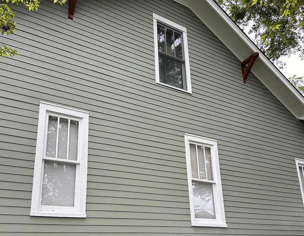 Side of nice home with new color mach james hardie siding
