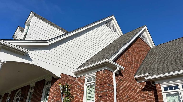 Siding installation on the side of the eves of a Nashville home