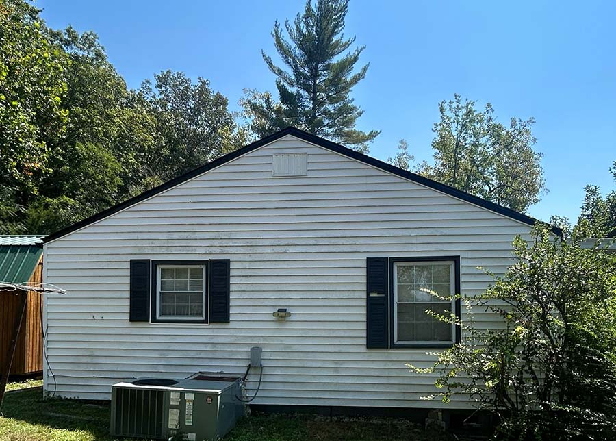 Before image of the side of a home needing siding replacement in AShland City