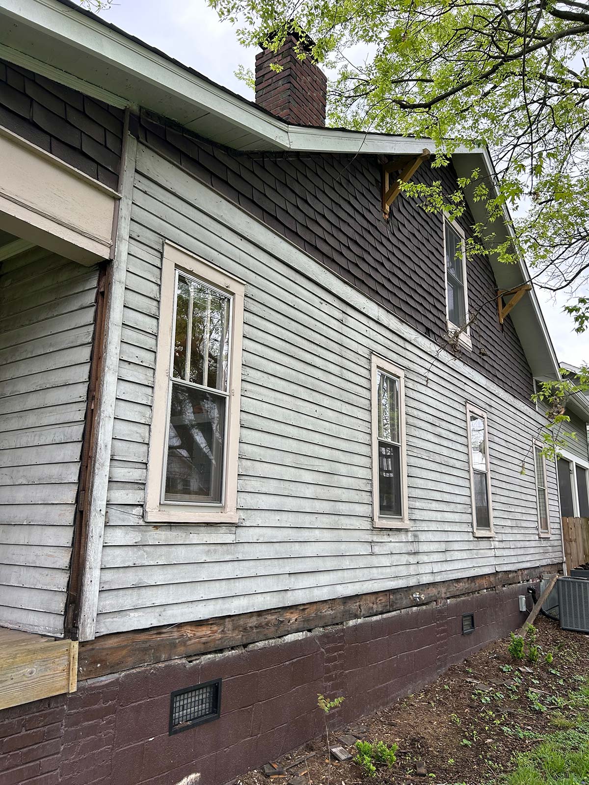 The Illinois Project - Located in The Nations Neighborhood in North West Nashville - Before image showing old wood siding from the side of the house