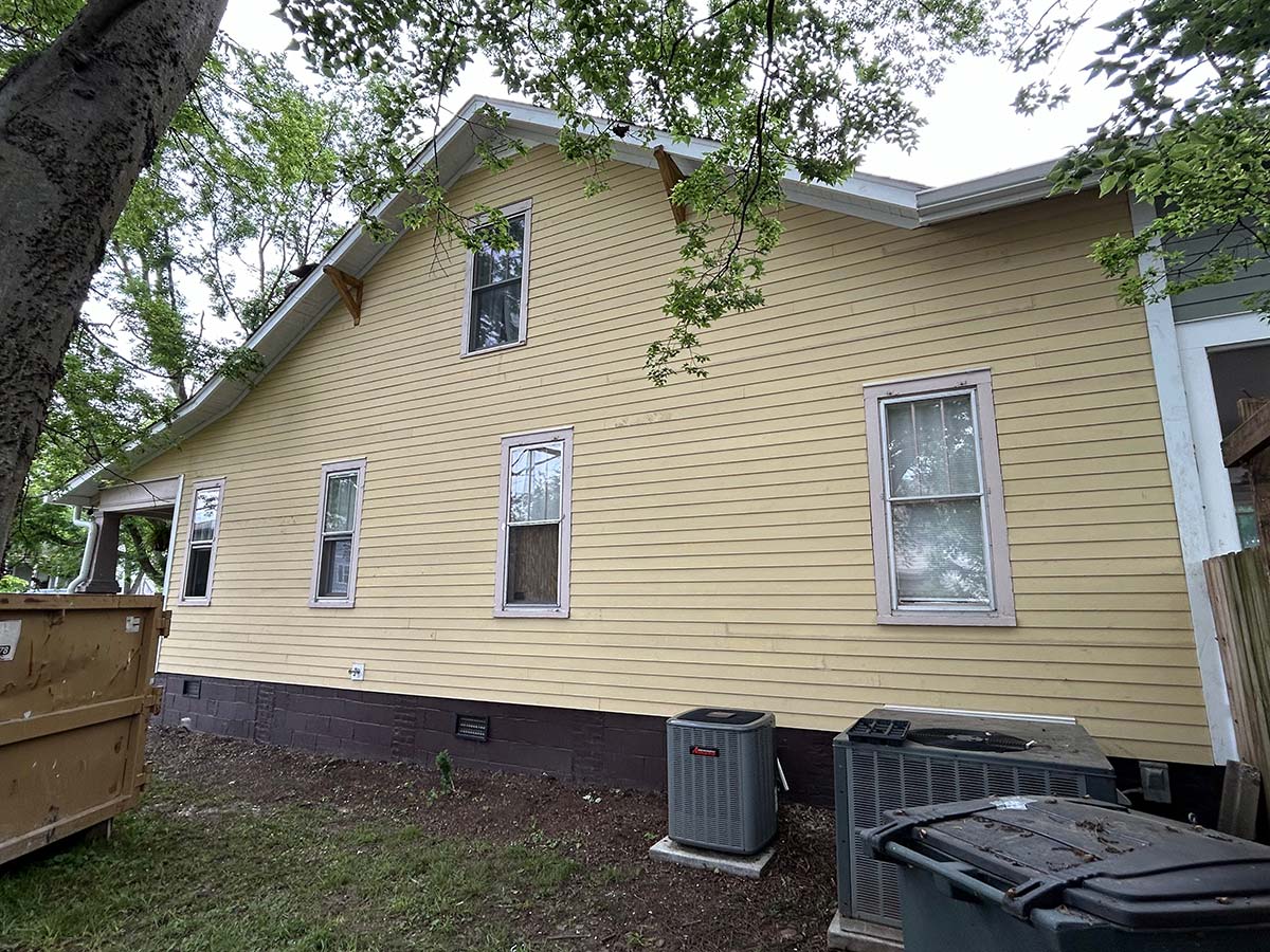 The Illinois Project - Located in The Nations Neighborhood in North West Nashville - Before image showing the crew working on putting up the new siding before the paint