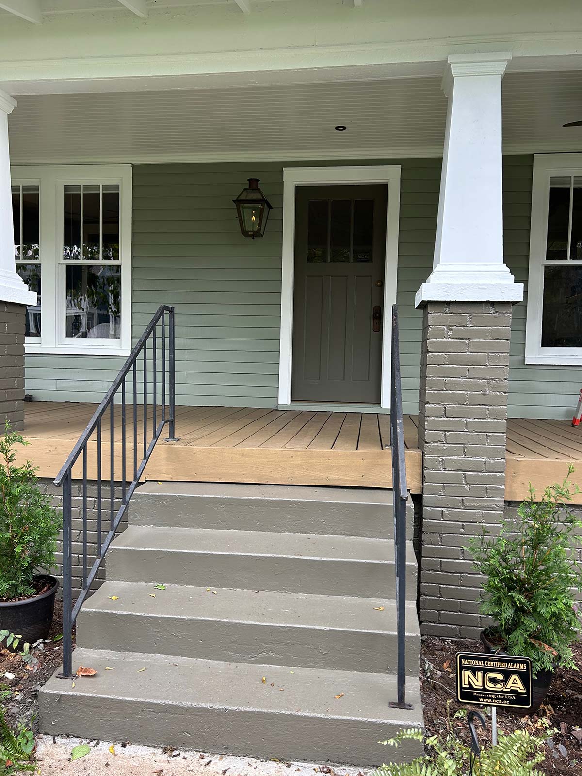 The Illinois Project After - Located in The Nations Neighborhood in North West Nashville - After image showing the new James Hardie Siding installation with the new front porch and fresh paint